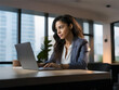 © Jota - businesswoman working on laptop