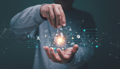 Poster - Business global internet connection application technology and digital marketing, Hand holding lightbulb with business icon on network connection, Idea for business target, Digital link tech.