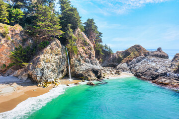 Wall Mural - McWay Falls on Highway 1 and Big Sur along the Pacific Ocean coast, beautiful landscape and aerial view, sunset, sunrise, fog. Concept, travel, vacation, weekend