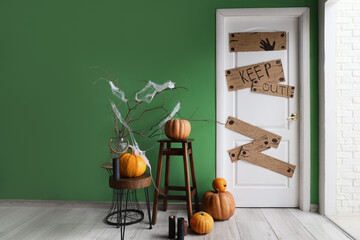 Wall Mural - Interior of hallway decorated for Halloween with boarded up door and pumpkins