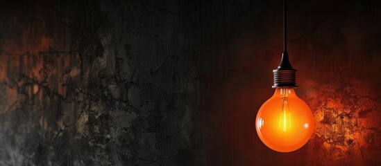 Wall Mural - orange bulb light on the blackceiling