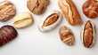© Pointofview - A row of different types of bread on a white background