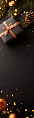 Wall Mural - black box with a gold ribbon sits on a black background. the box is decorated with gold ribbons and 