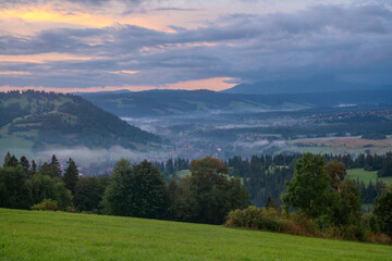 Wall Mural - beautiful, misty sunrise over a mountain village in the carpathian mountains.poland