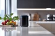© Arbystudio - Black Smart Speaker on White Kitchen Countertop