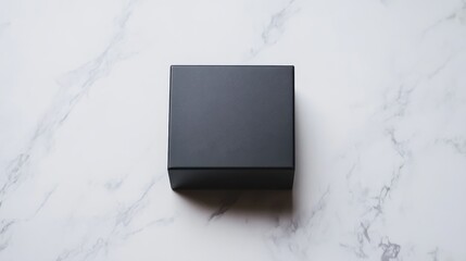  - a matte black box is positioned slightly open on a smooth white marble surface, highlighting its min