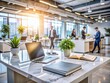 © Four888 - Busy modern office ambiance with blurred background, sleek white marble tabletop, scattered papers, laptops, and office supplies in a hectic work environment.