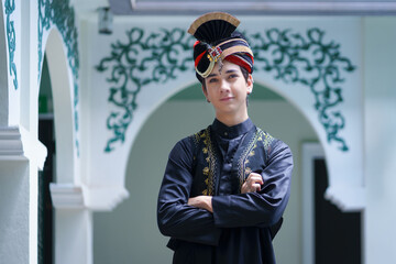 A smart Asian Indian man in fashionable wearing Hindu dress a traditional costume.  Portrait of a young Indian male model in Traditional Indian costume outfits the most famous clothes in the world.