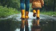 © VeloonaP - Parent and child walking in the rain, wearing yellow boots, creating reflections in a puddle. Close-up shot emphasizing their lower bodies.