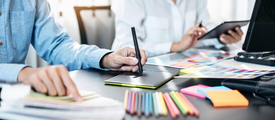 Poster - Team of creative graphic designer working on color swatch samples chart for selection coloring in inspiration to create new collection at workplace