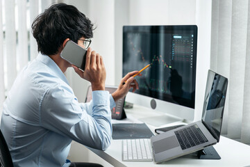 Poster - Businessman investor working with smartphone and computer analyzing graph stock market trading planning with chart data financial investment planning