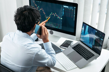 Poster - Businessman investor working with smartphone and computer analyzing graph stock market trading planning with chart data financial investment planning