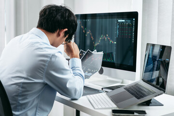 Poster - Businessman investor working and stress with computer analyzing graph stock market trading planning with chart data financial investment planning