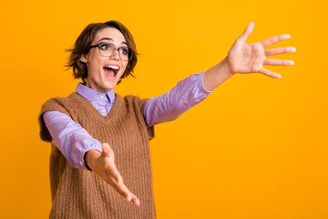 Poster - Photo portrait of attractive young woman stretch hands excited want hug dressed retro office clothes isolated on yellow color background