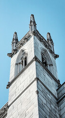 stone tower facade with architectural detail - vintage  blue sky  architecture photo