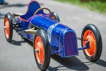 Close-up of a colorful soapbox, race car on a track, showcasing speed and competition at a motorsport event, evoking the excitement of classic racing.