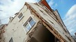 © Emma - An earthquake causing a building to tilt dangerously, with cracks appearing in the walls