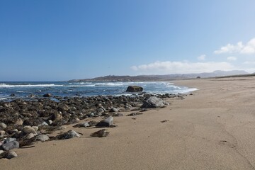 Beach landscape view near Russian border on a sunny spring day, Grense Jakobselv, Norway.