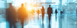 © fadi - business people walking in the corridor of an business center, pronounced motion blur, crowded bright modern light office movement defocused. office background busy. talking and rushing in the lobby.