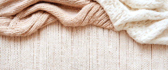 Soft knitted textures in neutral tones closeup. Winter fashion and home decor elements. Place for text