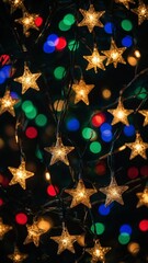 Poster - Colorful Christmas lights with glowing star-shaped lights against dark background