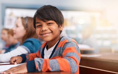 Poster - Portrait, smile and boy in classroom for learning in growth, child development and notebook for education. Happy, lesson and face of student with exam notes, knowledge and study at elementary school