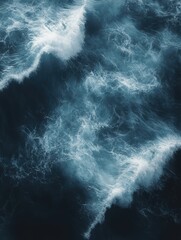 Poster - A top-down view of an ocean with waves, dark blue and white colors, surrealism, dark background