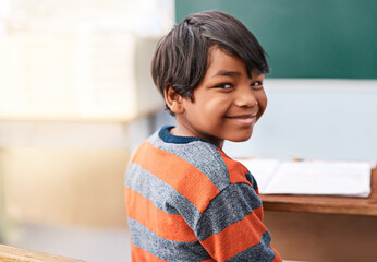 Poster - Portrait, happy and boy in class for education in growth, child development and notebook for education. Smile, learning and face of student with exam notes, knowledge and study at elementary school