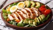 © Pricha.RT - A colorful protein-packed salad with grilled chicken, eggs, and avocado, with room for text on the bottom.