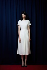 A half-america happy woman in a clean white dress footwear standing curtain.