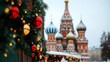 © fotogurme - Christmas market in Moscow's Red Square, with colorful domes of St Basil’s Cathedral in the background and snow gently falling