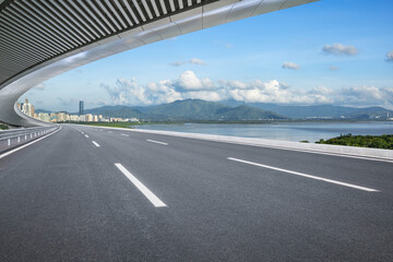 Poster - Asphalt highway road and bridge with skyline scenery. car advertising background.