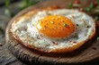 © julija - perfectly fried egg on rustic wooden surface vibrant yolk wispy edges food photography style