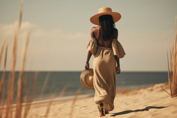 Wall Mural - african black woman walking summer beach.