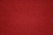 © Exclusive  - The vibrant red surface features fine grains and a smooth texture, highlighting the richness of color perfect for creative projects or background settings