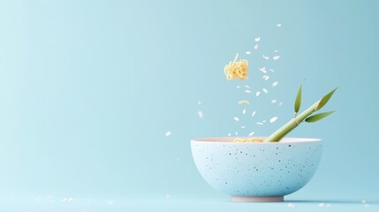 Wall Mural - A bowl with noodles and green shoots against a light blue background, suggesting freshness.