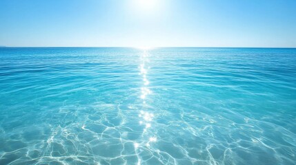 crystal clear blue sea water rippling under soft sunlight creating a sense of serenity and open spac