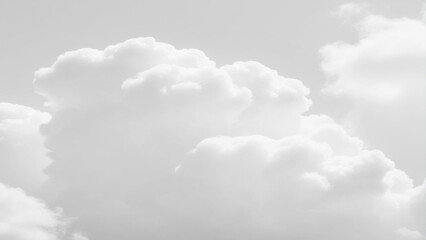 Wall Mural - White Clouds from above. Aerial view of the fluffy white cloud on blue sky. Top view from an airplane over white clouds
