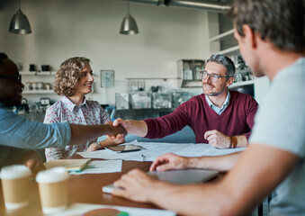 Wall Mural - Planning, teamwork and handshake with business people in office for collaboration, design proposal and deal. Meeting, success and startup launch with employees in creative agency for solution