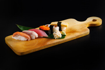 Wall Mural - Sushi sashimi set Japanese food Japanese seafood isolated in black background