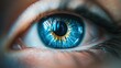 © Suphawan - A striking close-up of a blue eye, showing the intricate patterns in the iris with natural light reflecting off it.