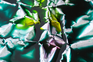 Macro Details of Crumpled Aluminium Foil with Green, Yellow and Red Food Coloring