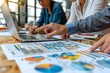 © Imagentive - Casual Business Meeting Reviewing Data and Project Plans
