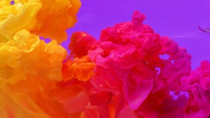 Poster - Yellow and pink ink are slowly mixing together on a bright purple background