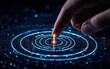 © VANATSANUN - A hand touches a glowing circle, creating a ripple effect of light in a digital universe, symbolizing interaction and technology.