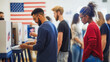 © JM_GUERRERO - A group of people are voting in a polling station