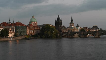 Wall Mural - Time lapse video evening view of the iconic Charles Bridge over Vltava river and Prague Old town cityscape, in Prague, Czech Republic