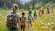© Mahemud - Group of school children with a teacher on a field trip in nature, learning science
