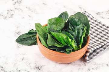 Ripe green spinach leaves heap