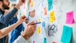 © Elmira - A diverse group of professionals engages in a collaborative brainstorming session at a whiteboard, surrounded by colorful sticky notes filled with ideas and sketches